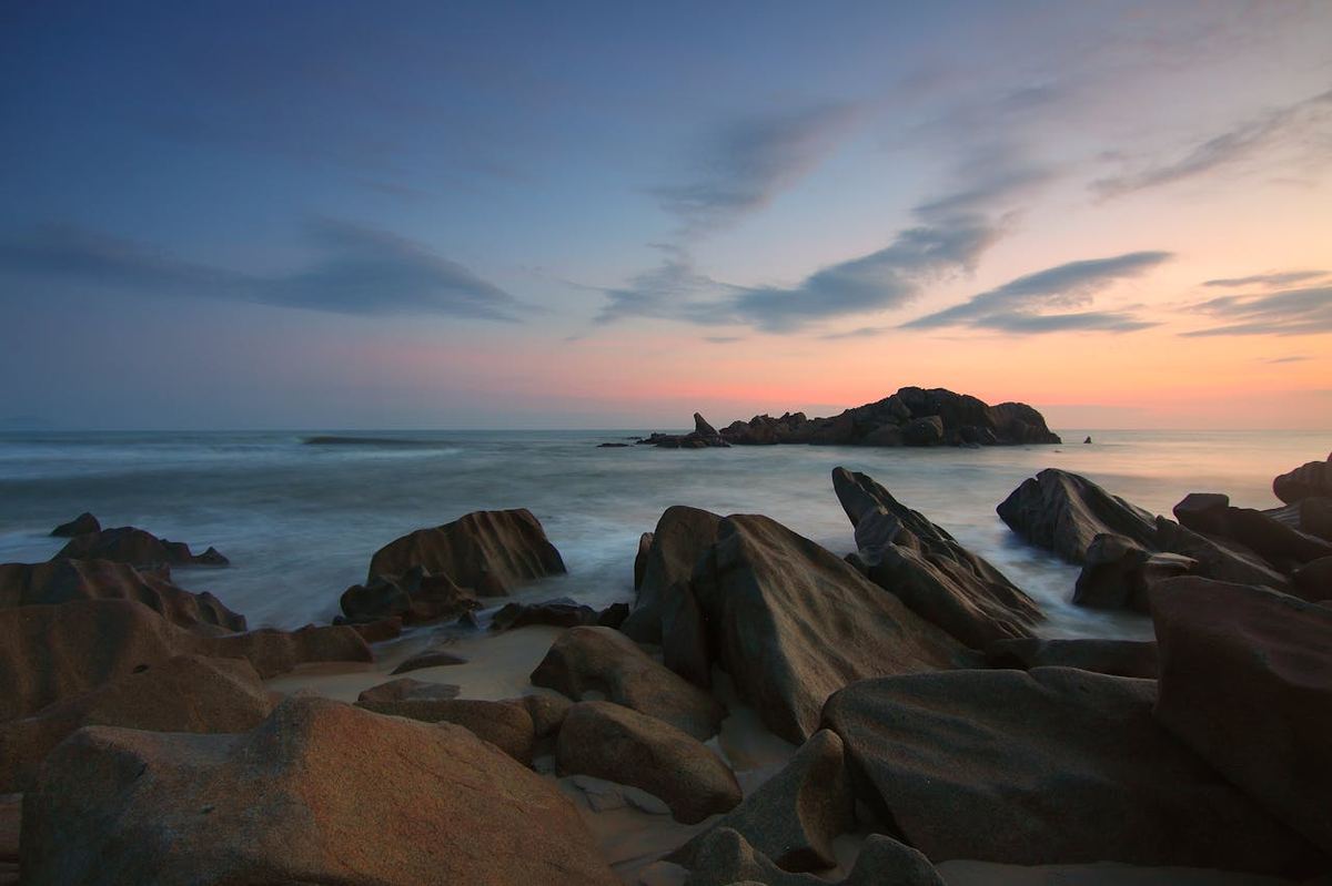 Neil Island rocky beach with dramatic sunset sky